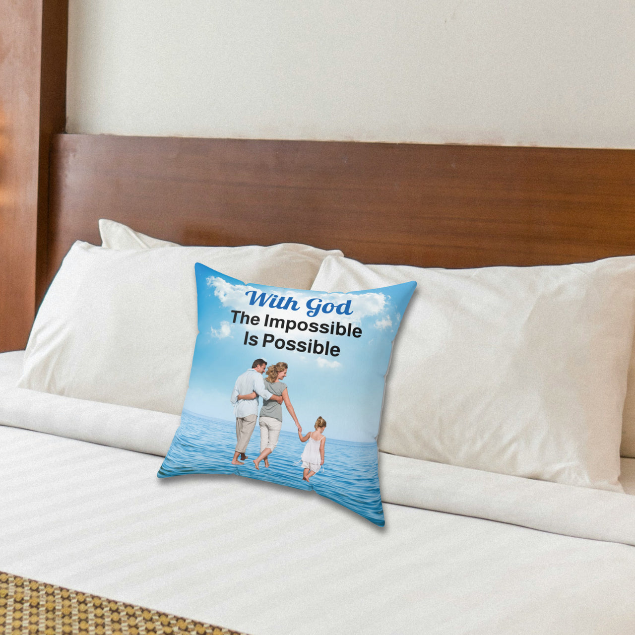 Faith-based throw pillow with “Impossible Family” design, family walking on water with message "With God, The Impossible Is Possible," inspirational home décor, reversible with white or sea blue back, spun polyester, 4 sizes, 14x14 on bed