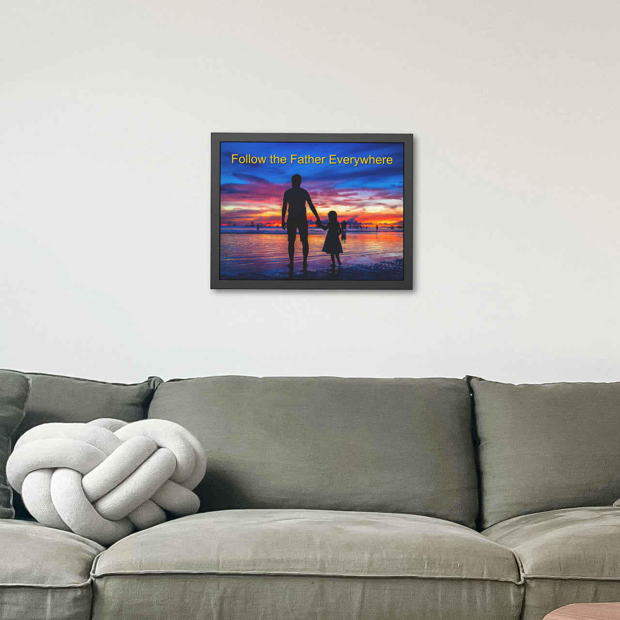 Black wood framed inspirational poster with “Follow the Father” design, child walking with father with the message "Follow the Father Everywhere," semi-gloss finish, shatter-proof plexiglass, available in 3 sizes, 24x18 framed poster on wall