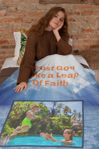 Plush velveteen blanket with “Leap of Faith” design, child jumping into pool, inspirational message