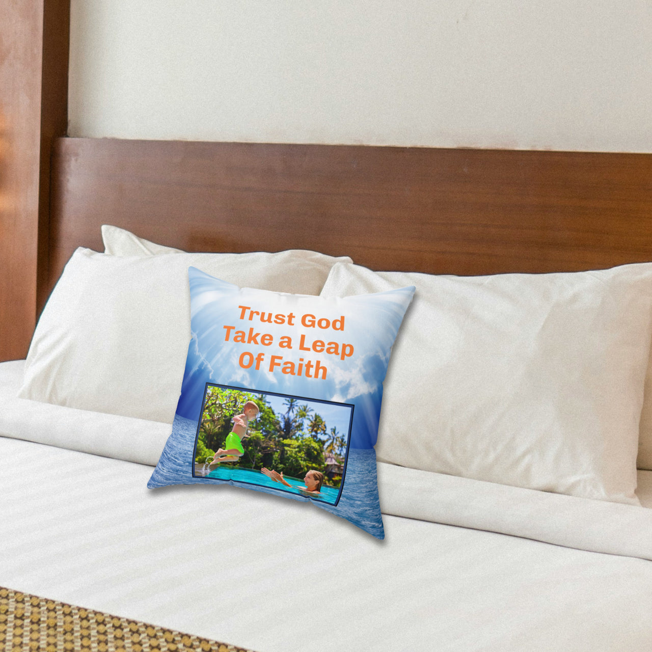 Inspirational throw pillow with “Leap of Faith” design, child jumping into pool, faith-based message "Trust God, Take a Leap of Faith," faith-based home décor, reversible with white or blue back, spun polyester, 4 sizes, 14x14 on bed