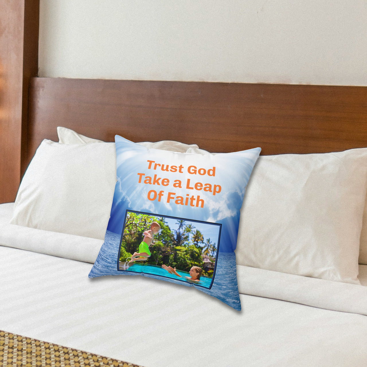 Inspirational throw pillow with “Leap of Faith” design, child jumping into pool, faith-based message "Trust God, Take a Leap of Faith," faith-based home décor, reversible with white or blue back, spun polyester, 4 sizes, 16x16 on bed