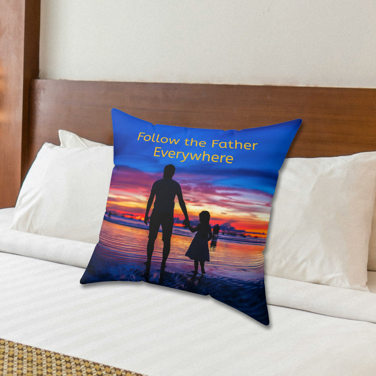 Faith-based throw pillow with “Follow the Father” design, child walking with father, inspirational message "Follow the Father Everywhere, reversible with white or royal blue back, spun polyester, 4 sizes, 20x20 on bed