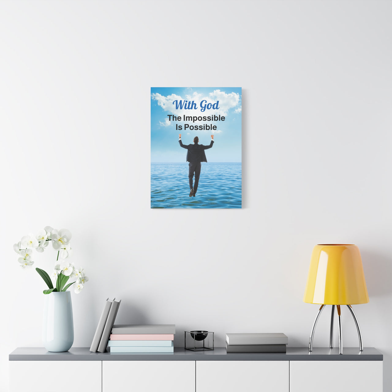 Canvas wall art with “Impossible Man” design, man walking on water with the message "With God, The Impossible Is Possible," pinewood frame, faith-based inspirational message, ready to hang, 18x24 canvas wall art on wall
