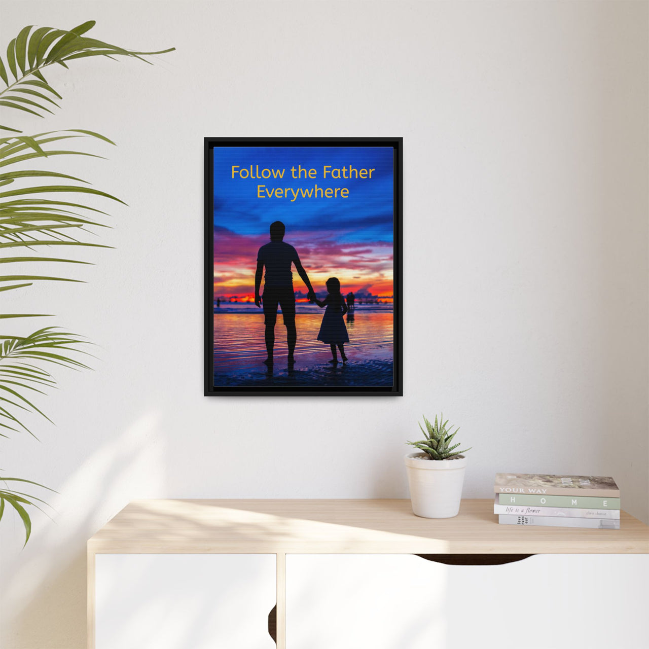 Framed canvas wall art with “Follow the Father” design, child walking with father with message "Follow the Father Everywhere," inspirational message, black pinewood frame, ready to hang, 18x24 framed wall art on wall