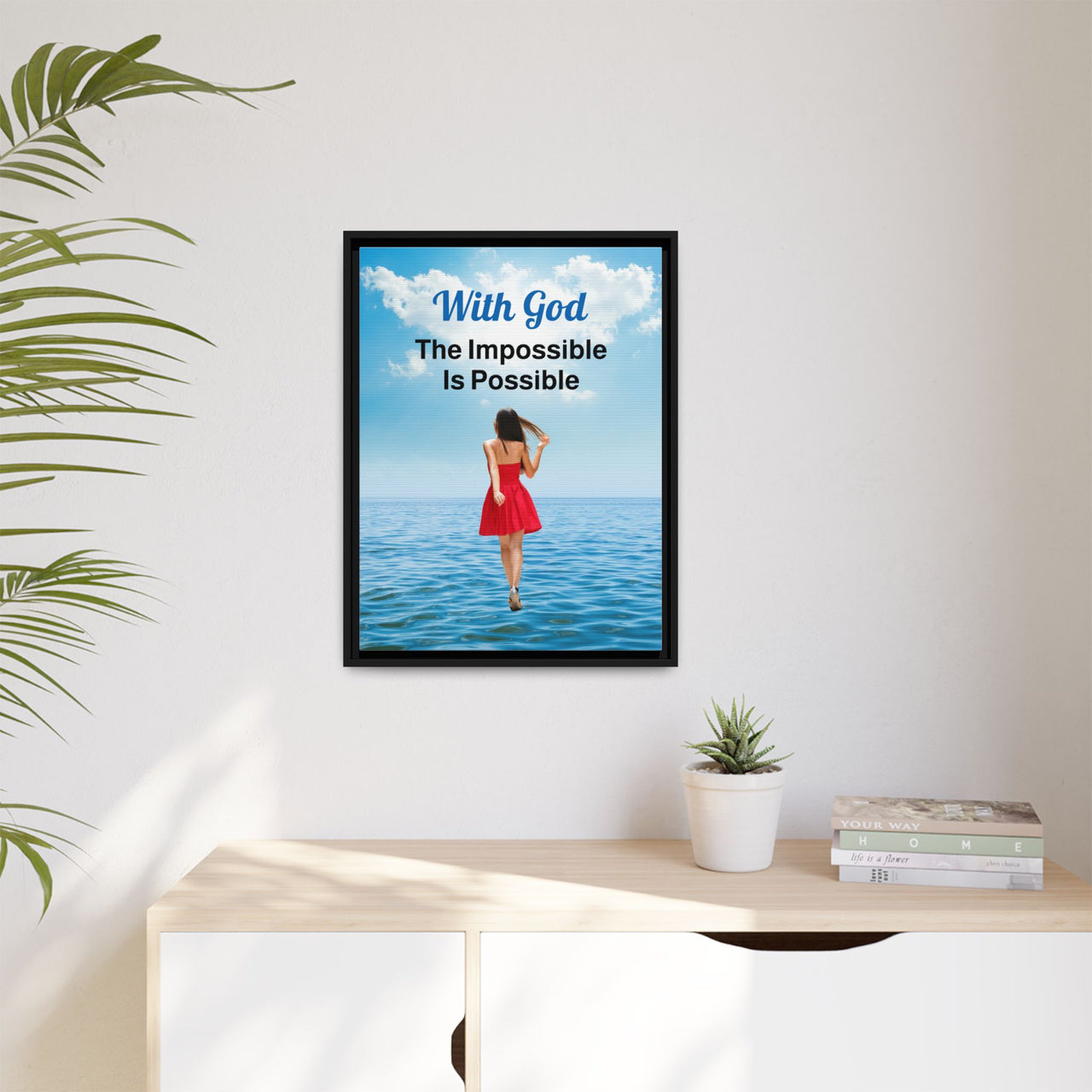Framed canvas wall art with “Impossible Woman” design, woman walking on water with message "With God, The Impossible Is Possible," spiritual message, black pinewood frame, ready to hang, 18x24 framed wall art on wall