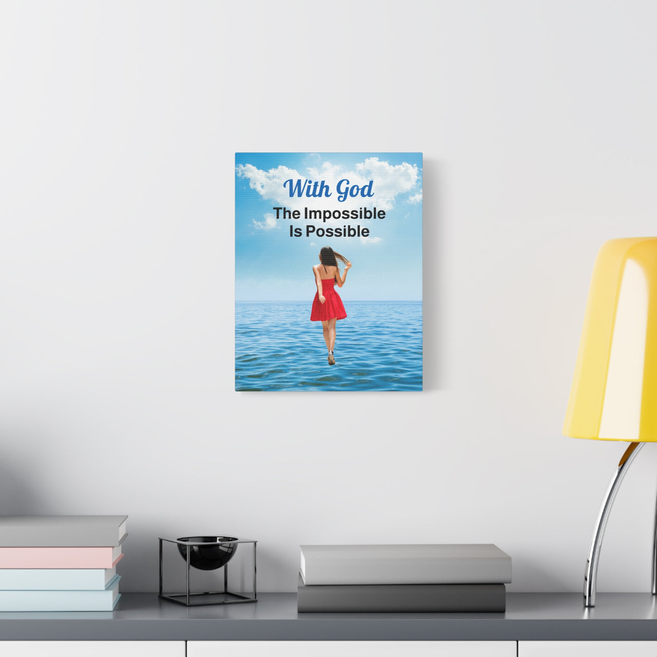 Canvas wall art with “Impossible Woman” design, woman walking on water with the message "With God, The Impossible Is Possible," pinewood frame, inspirational faith-based message, ready to hang, 11x14 canvas wall art on wall