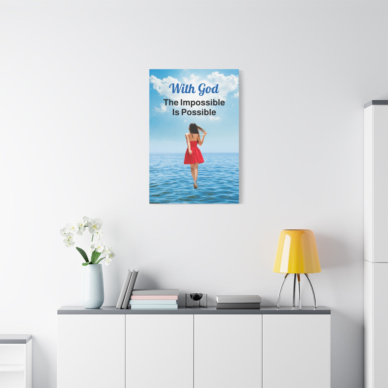 Canvas wall art with “Impossible Woman” design, woman walking on water with the message "With God, The Impossible Is Possible," pinewood frame, inspirational faith-based message, ready to hang, 24x36 canvas wall art on wall