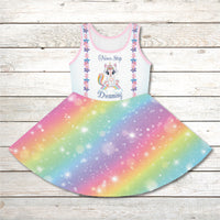 Pink girl's sundress with unicorn kitty and rainbow design, “Never Stop Dreaming” message, part of Paisley’s Treasure Chest Collection, lightweight polyester-spandex blend, ideal for summer and special occasions, front of unicorn kitty sundress