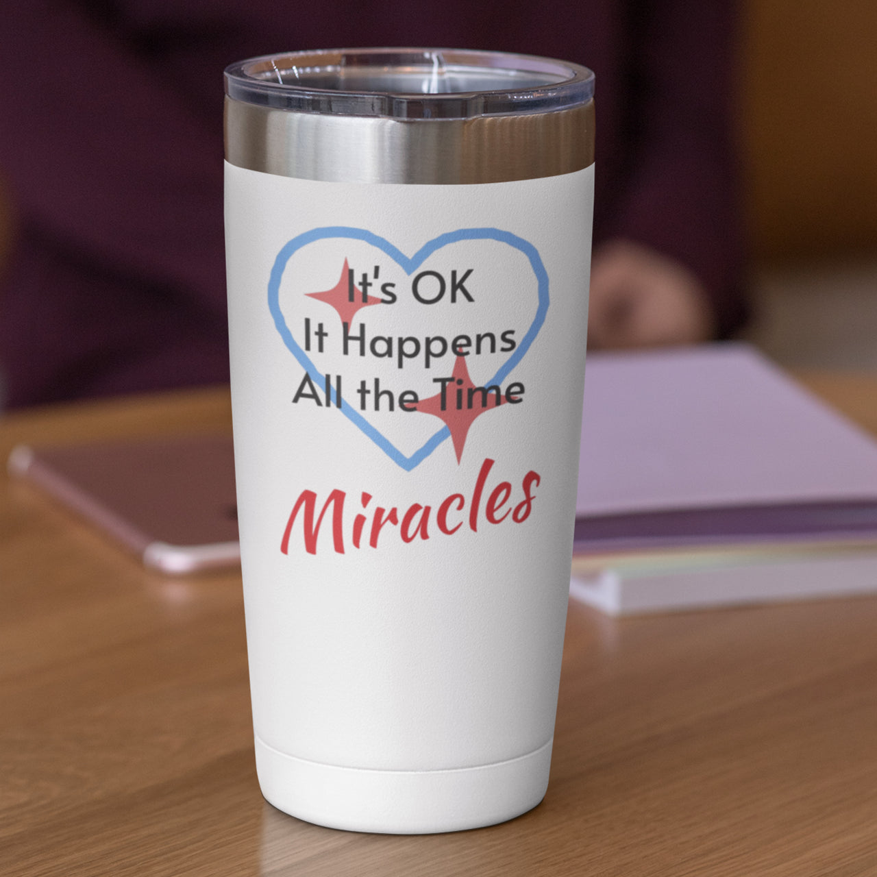 20oz faith-based stainless steel tumbler with "Miracles Happen" design, inspirational message “It’s OK. It Happens All the Time – Miracles,” leak-proof lid, spiritual drinkware for everyday encouragement, white tumbler