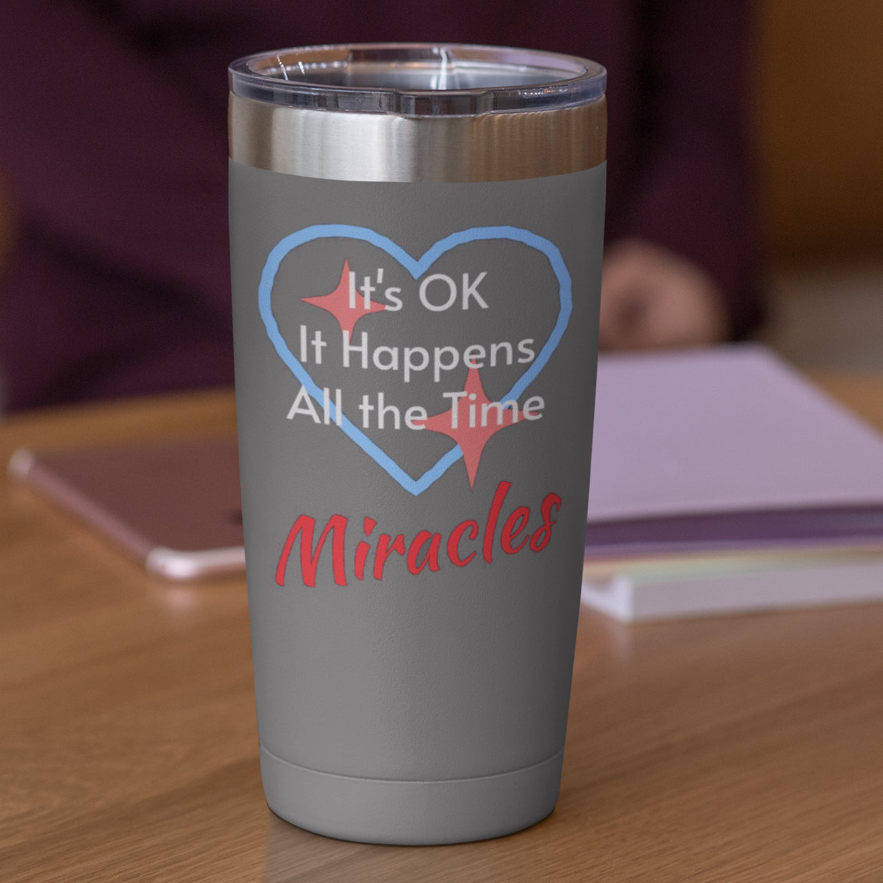 20oz faith-based stainless steel tumbler with "Miracles Happen" design, inspirational message “It’s OK. It Happens All the Time – Miracles,” leak-proof lid, spiritual drinkware for everyday encouragement, gray tumbler
