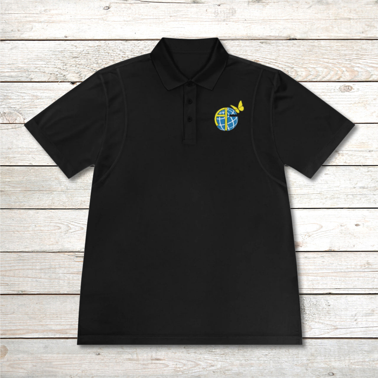 Men’s Sport-Tek polo shirt with Anakainoo International logo, moisture-wicking polyester with globe and butterfly design symbolizing spiritual renewal and transformation through intimacy with God, black polo shirt