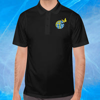 Men’s Sport-Tek polo shirt with Anakainoo International logo, moisture-wicking polyester with globe and butterfly design symbolizing spiritual renewal and transformation through intimacy with God, man wearing black polo shirt