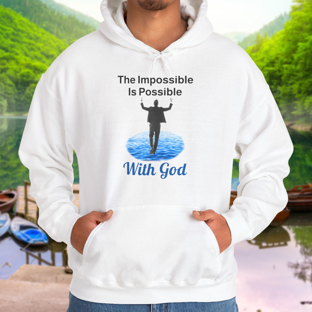 Gildan unisex hoodie with “Impossible Man” design featuring a man walking on water and uplifting message, Christian apparel made from soft cotton-poly blend, perfect for cold weather and spiritual encouragement, man in white hoodie