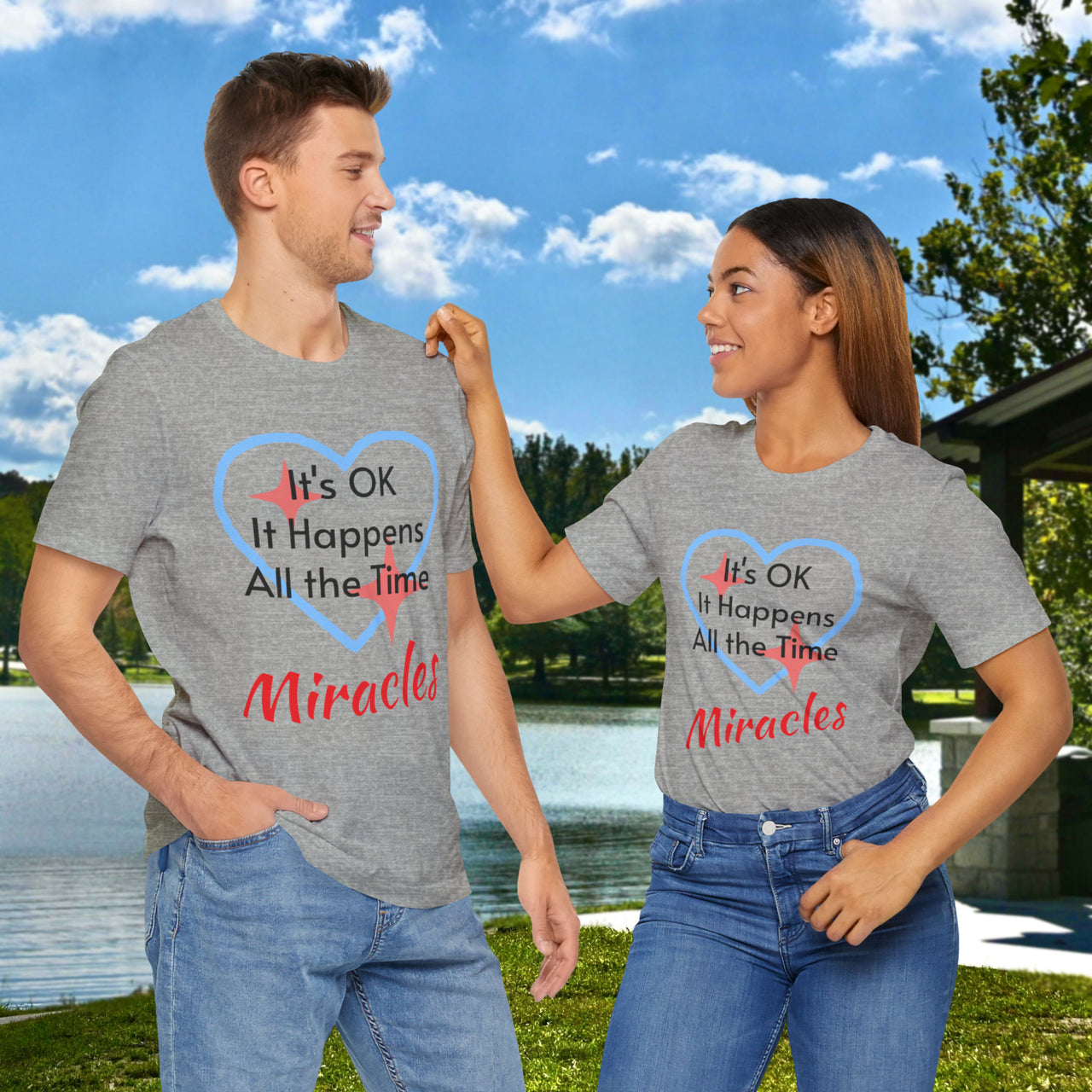 Soft, breathable Bella+Canvas t-shirt made from preshrunk cotton with “Miracles Happen” design message, “It’s OK. It Happens All the Time – Miracles,” inspirational shirt encouraging intimacy with God that produces everyday miracles, couple in gray shirt