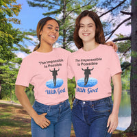 Soft, breathable Bella+Canvas t-shirt made from preshrunk cotton with “Impossible Man” design message, “The Impossible Is Possible with God,” inspirational shirt encouraging bold faith to step out and follow God into the impossible, friends in matching pink t-shirts