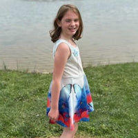 Blue girls’ sundress with butterfly and flower design, “I love you” message, part of Paisley’s Corner Collection, lightweight polyester-spandex blend, ideal for summer and special occasions, girl in butterfly sundress - right side view 2