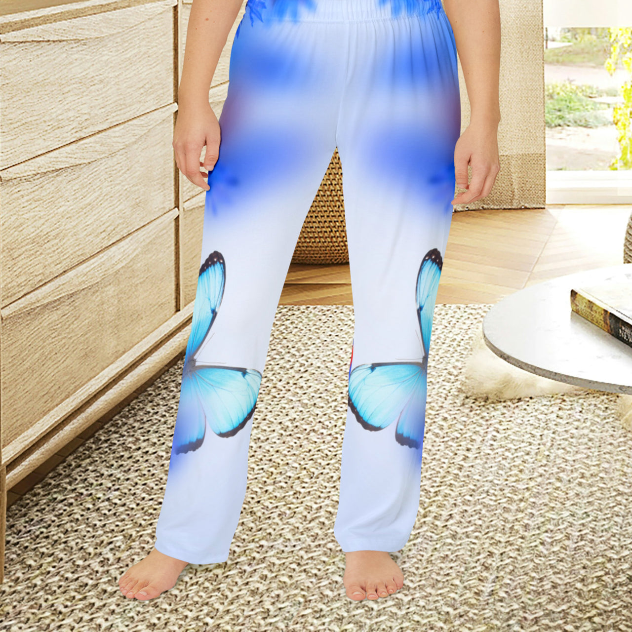 Girls’ butterfly lounge pants with blue butterfly and garden design, soft brushed polyester, elastic waistband, part of Paisley’s Corner Collection, ideal for sleepovers and cozy home wear, girl in butterfly lounge pants