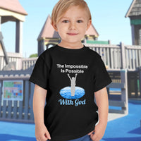 Bella+Canvas toddler t-shirt with “Impossible Toddler” design and faith-filled message, soft cotton, breathable and durable, Christian apparel for active toddlers and family matching, toddler boy in black t-shirt
