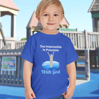Bella+Canvas toddler t-shirt with “Impossible Toddler” design and faith-filled message, soft cotton, breathable and durable, Christian apparel for active toddlers and family matching, toddler boy in blue t-shir