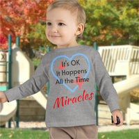 Rabbit Skins toddler long-sleeve t-shirt with “Miracles Happen” design and uplifting message, soft cotton, breathable and durable, Christian apparel for everyday wear and faith-filled gifting, todder boy in gray long-sleeve t-shirt