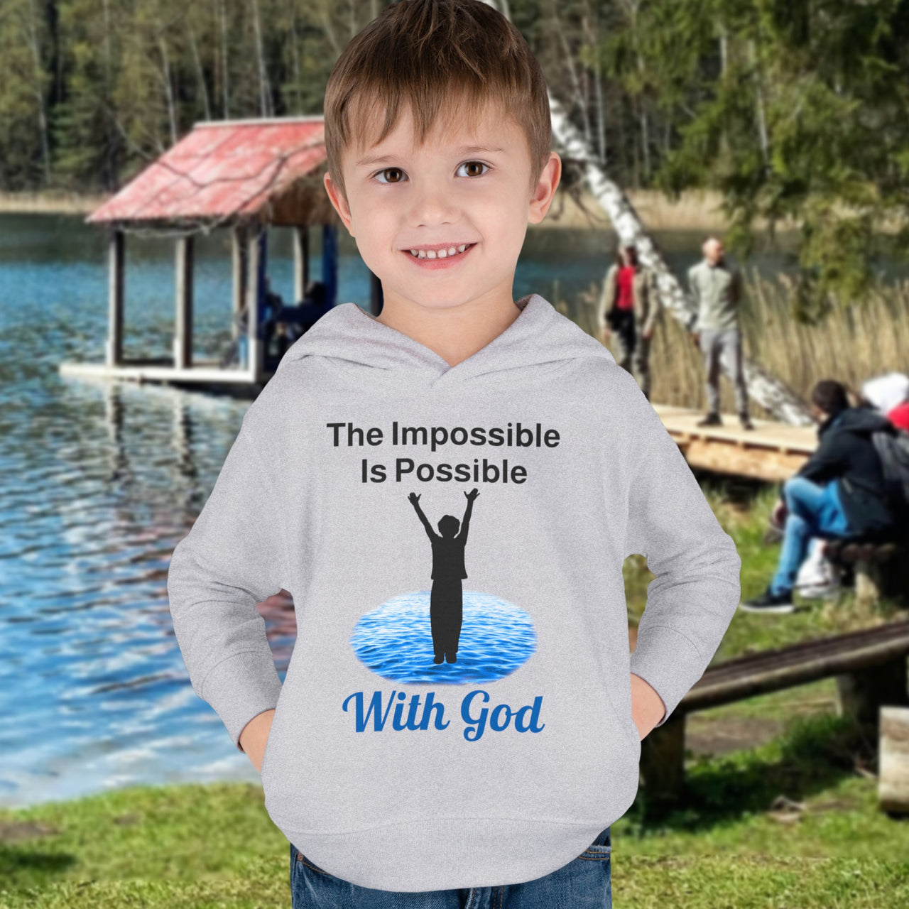 Rabbit Skins toddler fleece hoodie with “Impossible Toddler” design and faith-filled message, soft cotton-poly blend, durable stitching, Christian apparel for active toddlers and spiritual encouragement, toddler boy in gray hoodie