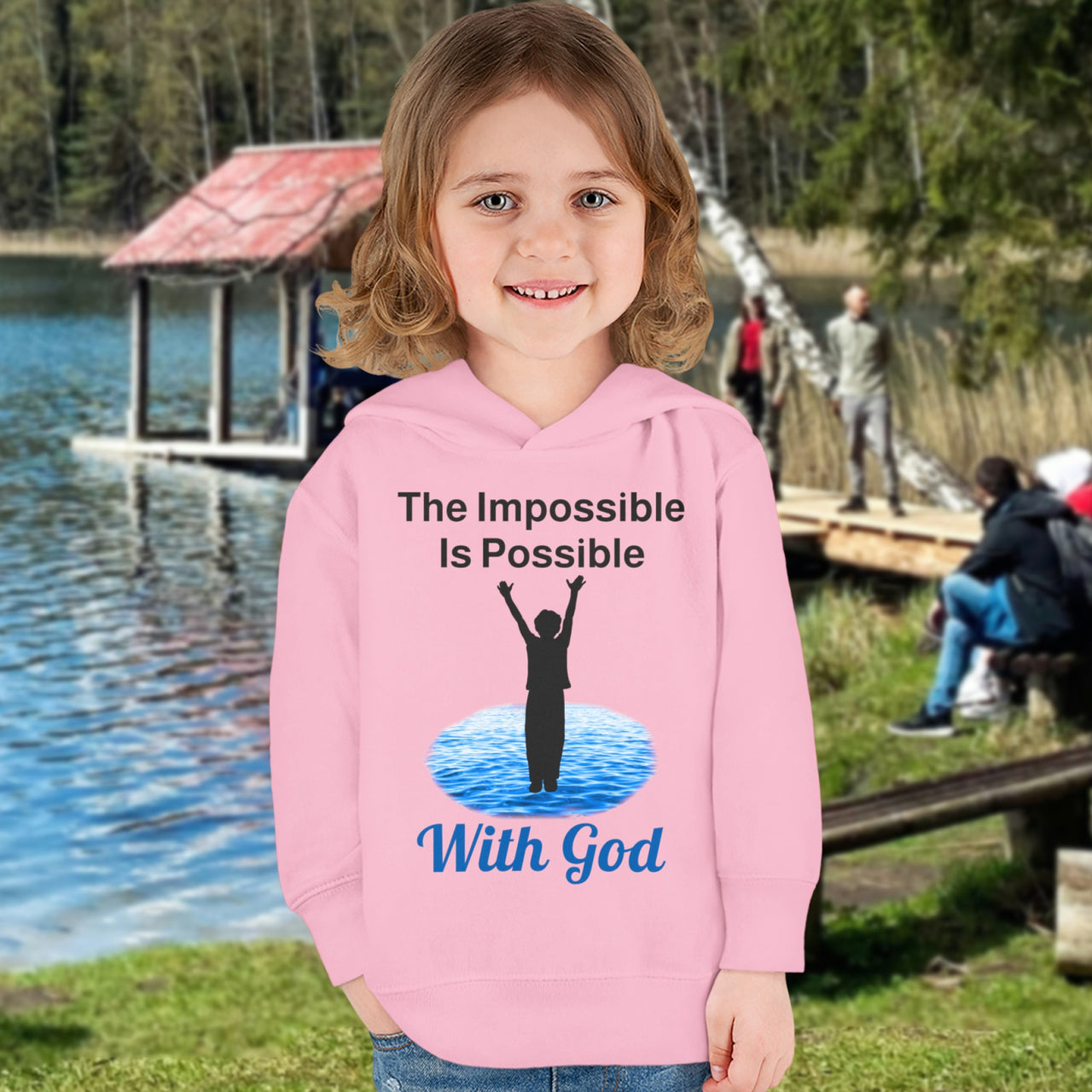 Rabbit Skins toddler fleece hoodie with “Impossible Toddler” design and faith-filled message, soft cotton-poly blend, durable stitching, Christian apparel for active toddlers and spiritual encouragement, toddler girl in pink hoodie