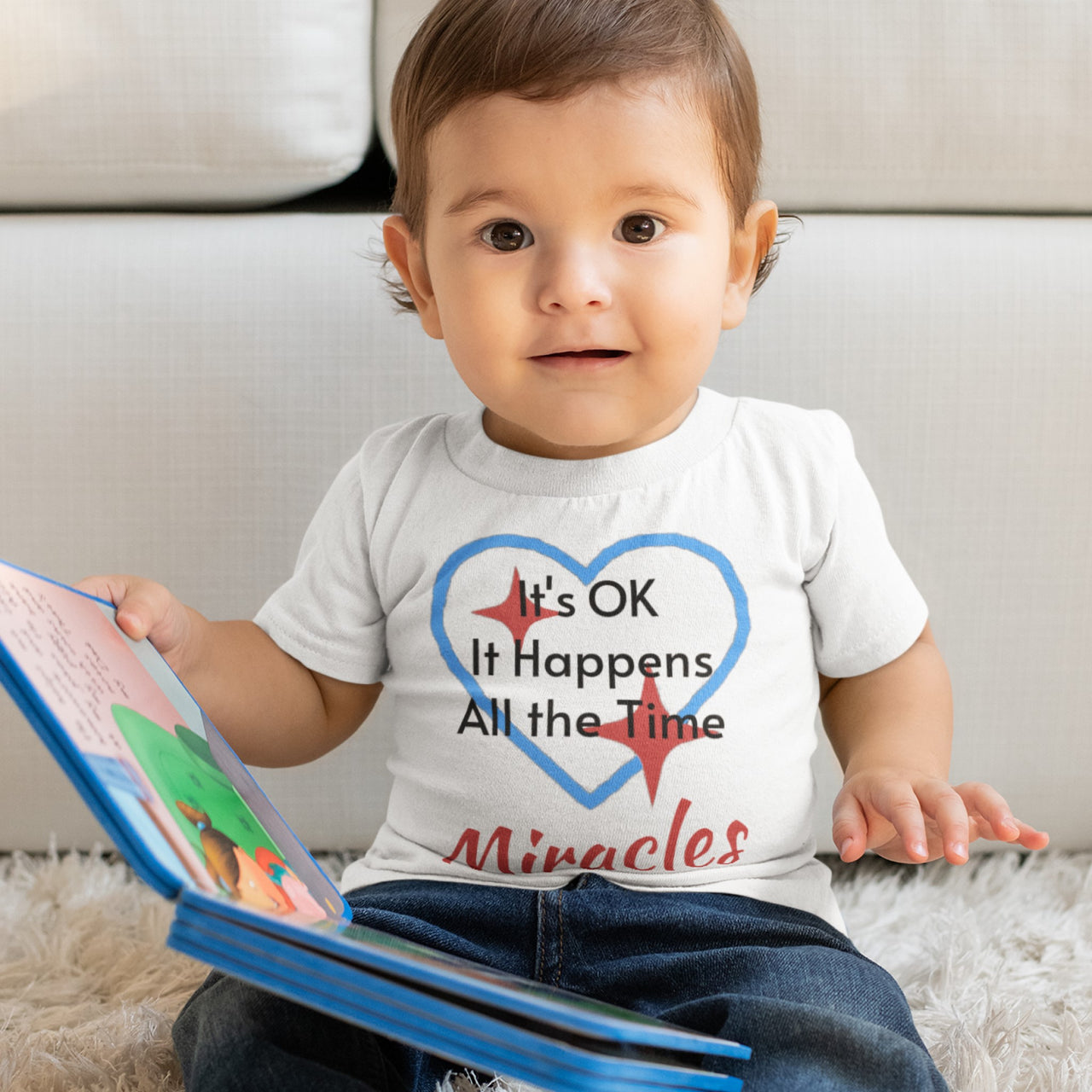 Bella+Canvas baby t-shirt with “Miracles Happen” design and uplifting message, soft cotton, breathable and durable, Christian apparel for infants and family matching, baby boy in white shirt
