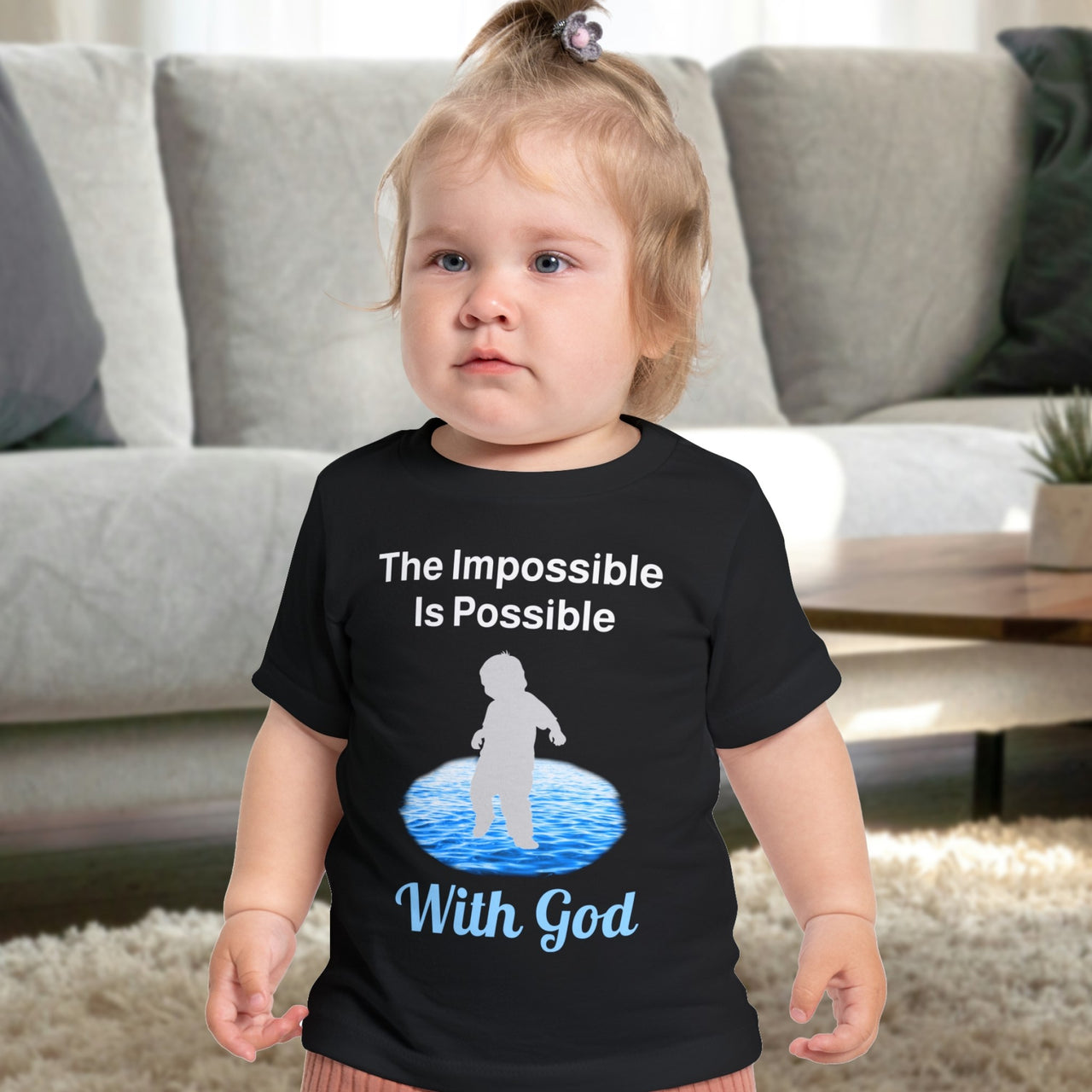 Bella+Canvas baby t-shirt with “Impossible Baby” design and faith-filled message, soft cotton, breathable and durable, Christian apparel for infants and family matching, baby in black shirt