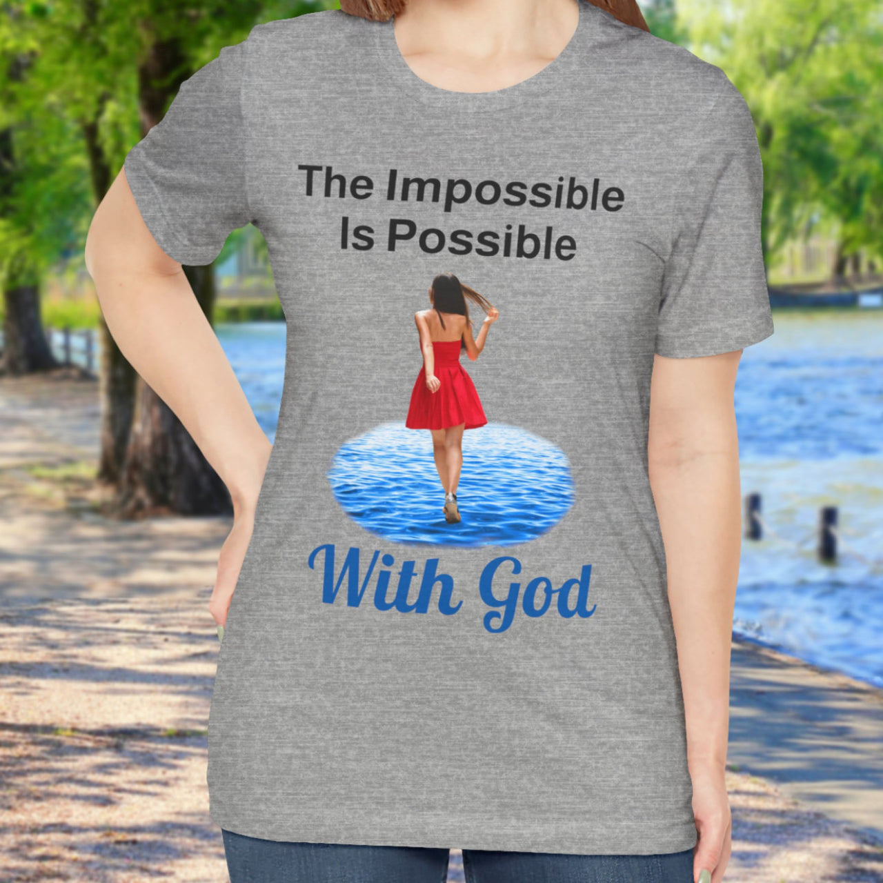 Soft, breathable Bella+Canvas t-shirt made from preshrunk cotton with “Impossible Woman” design message, “The Impossible Is Possible with God,” inspirational shirt encouraging bold obedience and faith-filled movement with God, woman in gray t-shirt