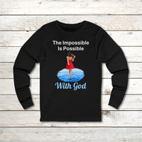 Long-sleeve Bella+Canvas t-shirt made from preshrunk ring-spun cotton with “Impossible Woman” design message, “The Impossible Is Possible with God,” inspirational apparel encouraging women to walk freely in God's incredible ways, front black long-sleeve t-shirt