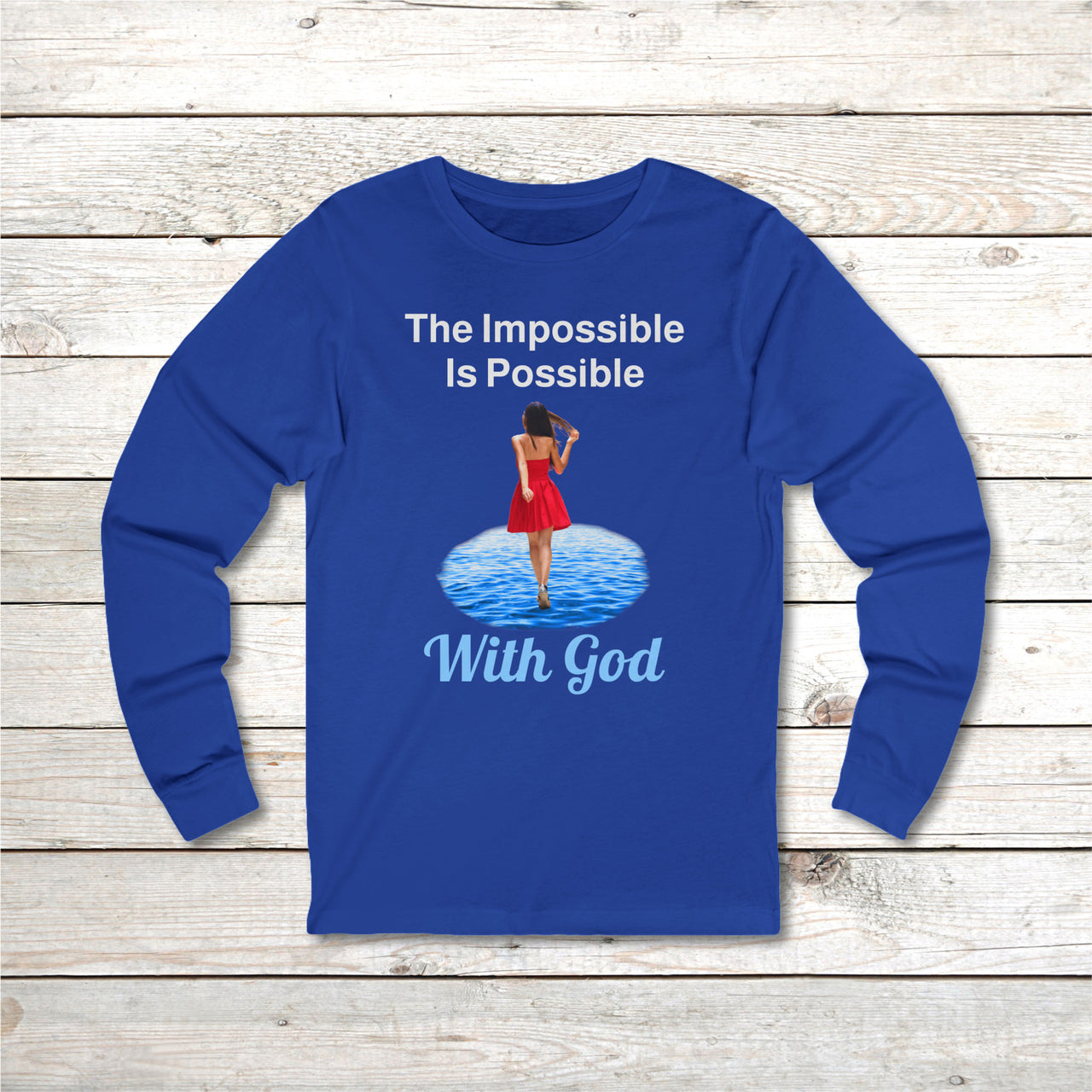 Long-sleeve Bella+Canvas t-shirt made from preshrunk ring-spun cotton with “Impossible Woman” design message, “The Impossible Is Possible with God,” inspirational apparel encouraging women to walk freely in God's incredible ways, front blue long-sleeve t-shirt