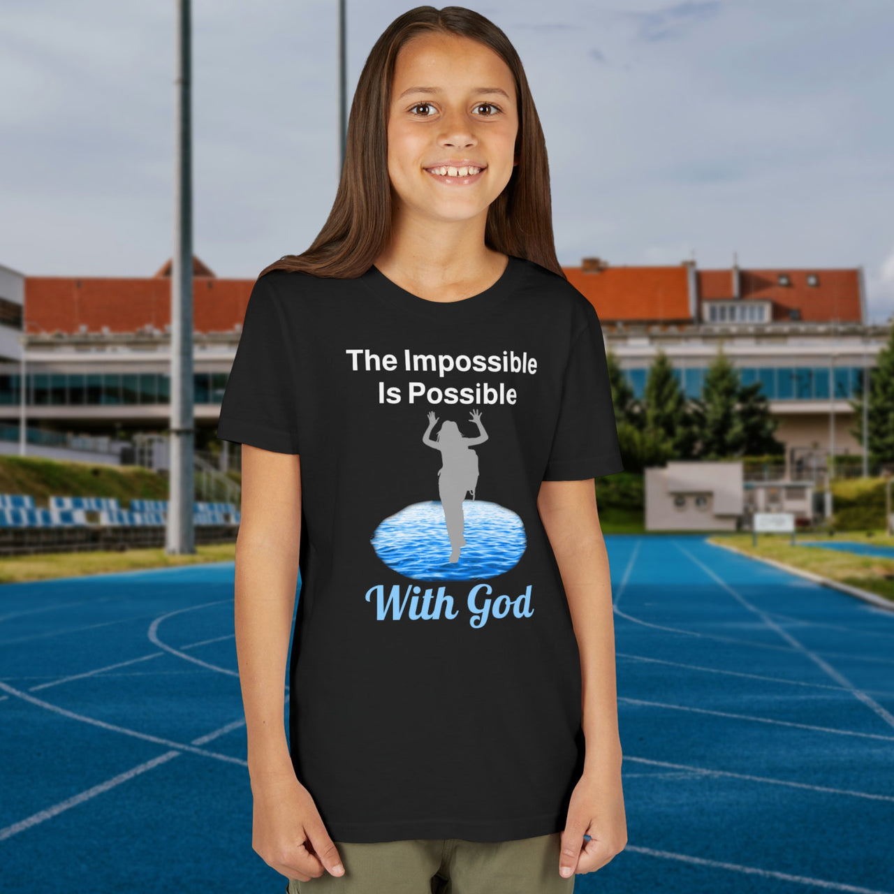 Bella+Canvas youth unisex t-shirt with “Impossible Girl” design featuring a girl walking on water and uplifting message, Christian apparel made from soft cotton, ideal for active wear and faith-forward style, 2nd girl in black t-shirt