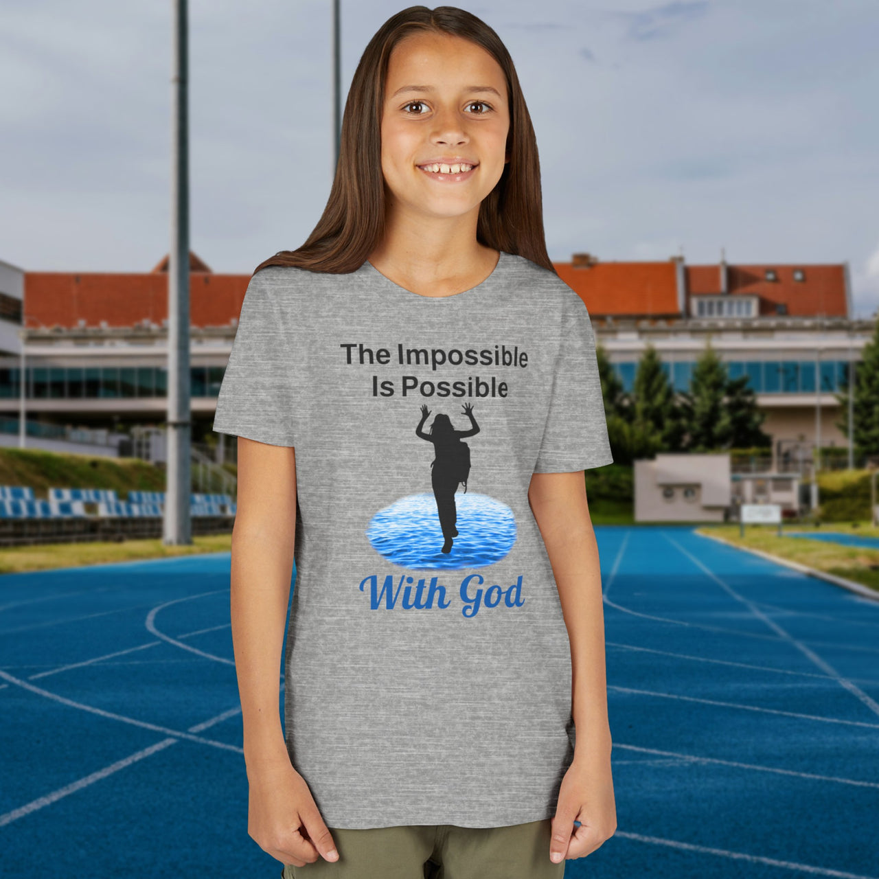 Bella+Canvas youth unisex t-shirt with “Impossible Girl” design featuring a girl walking on water and uplifting message, Christian apparel made from soft cotton, ideal for active wear and faith-forward style, 2nd girl in gray t-shirt