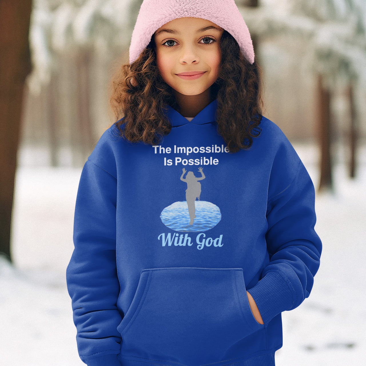 Gildan youth unisex hoodie with “Impossible Girl” design featuring a girl walking on water and uplifting message, Christian apparel made from soft preshrunk fleece, ideal for cooler weather and faith-forward style, girl in blue hoodie