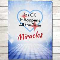 Inspirational plush blanket with “Miracles Happen” design and message 