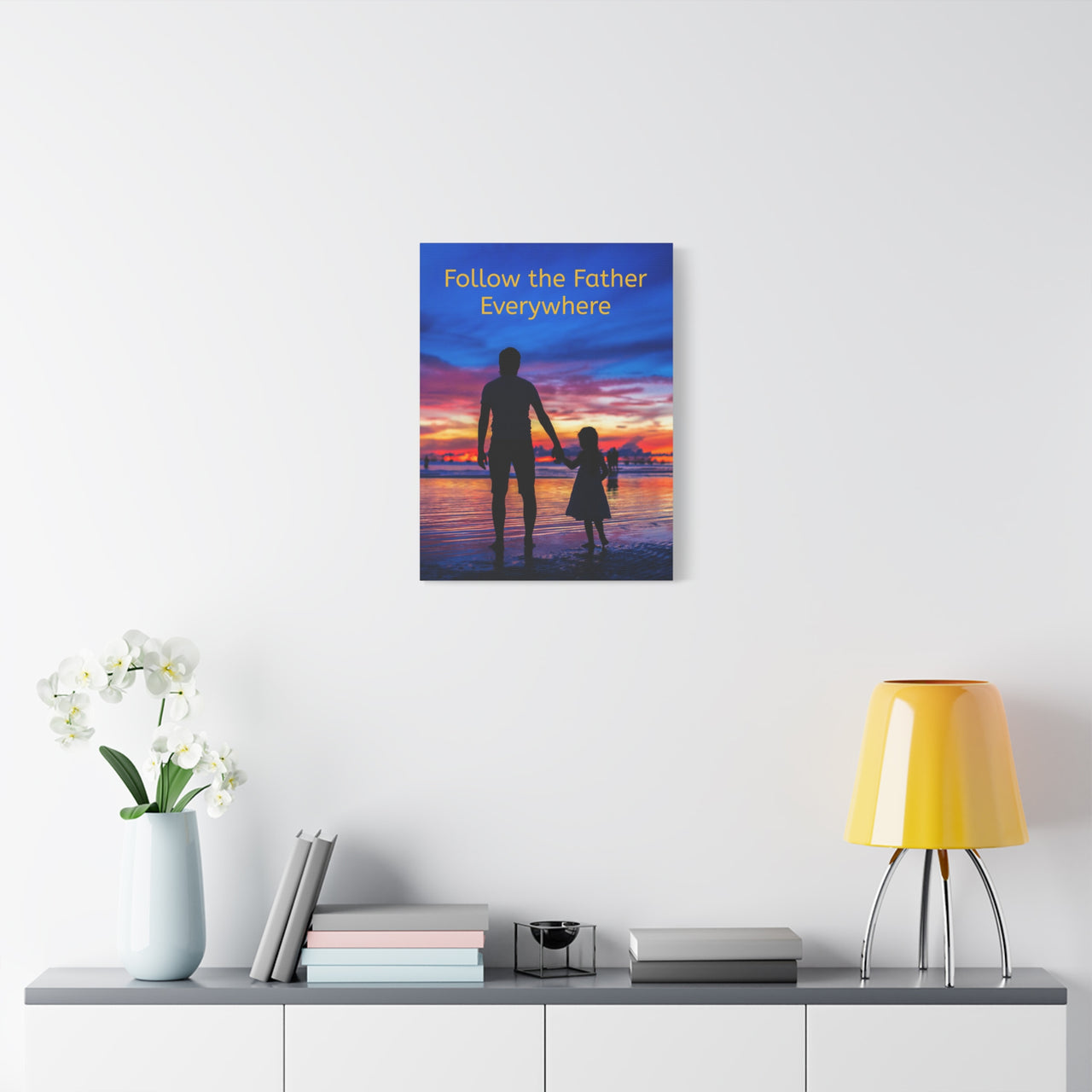 Canvas wall art with “Follow the Father” design, child walking with father with the message "Follow the Father Everywhere," pinewood frame, Christian spiritual message, ready to hang, 18x24 wall art on wall