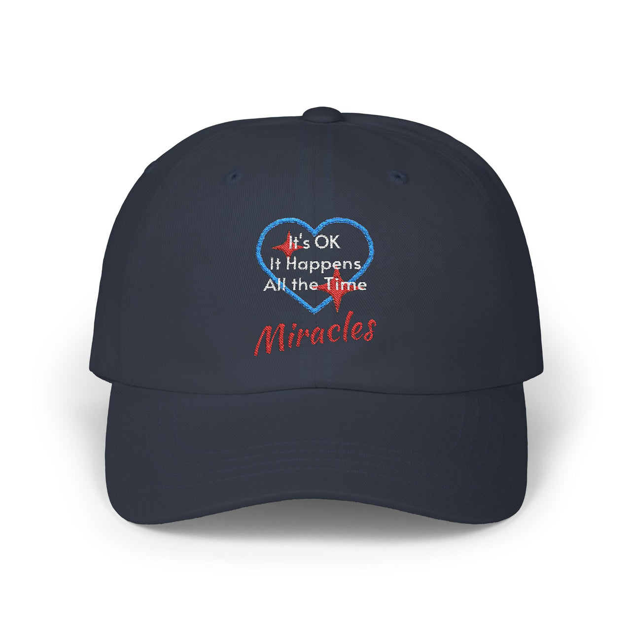Classic cotton baseball cap with "Miracles Happen" design, message “It’s OK. It Happens All the Time – Miracles,” adjustable fit, spiritual hat for everyday encouragement, navy cap
