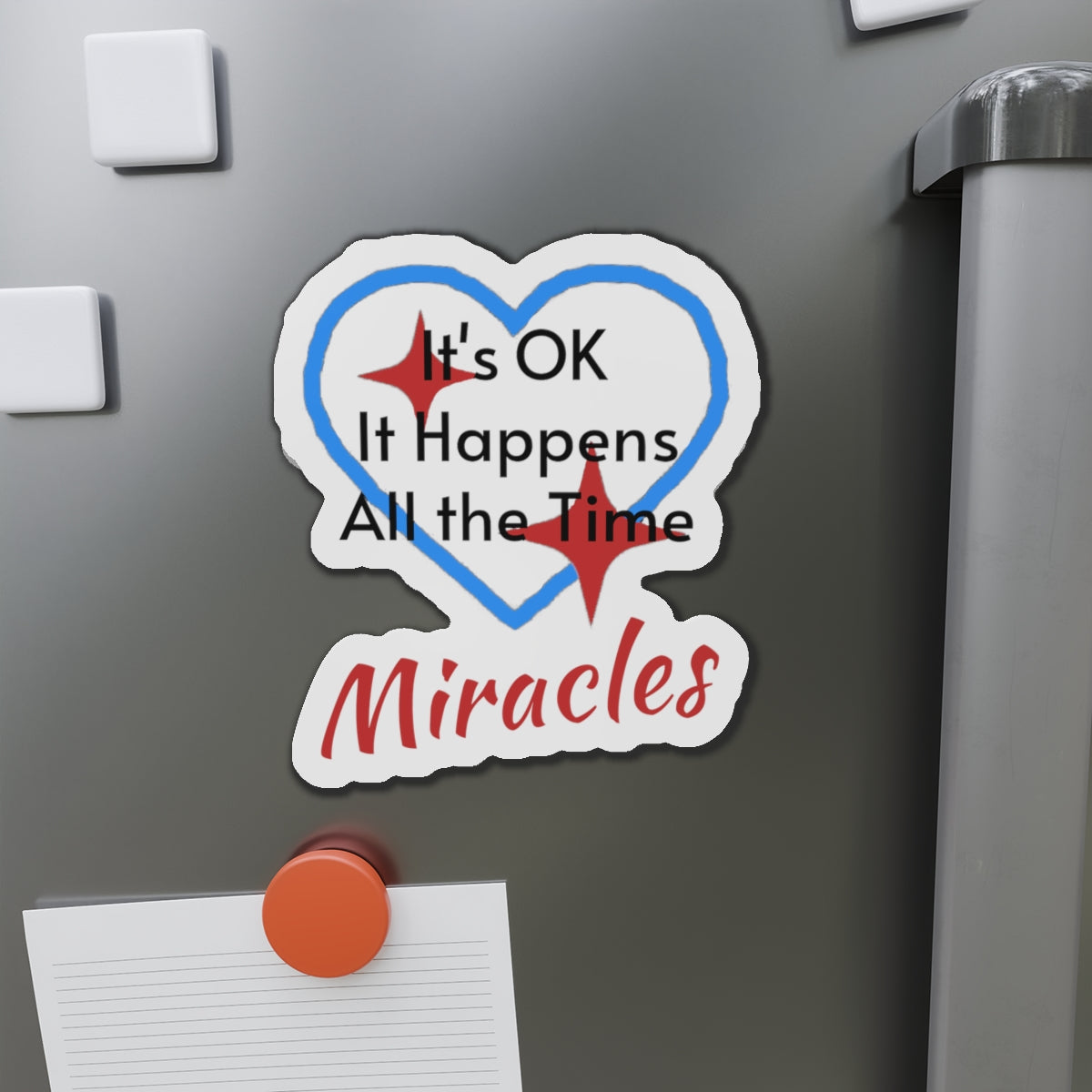Vinyl die-cut magnet with "Miracles Happen" design, message “It’s OK. It Happens All the Time – Miracles,” durable matte finish, faith-based magnet for those desiring to encounter miracles often, 6-inch magnet on fridge